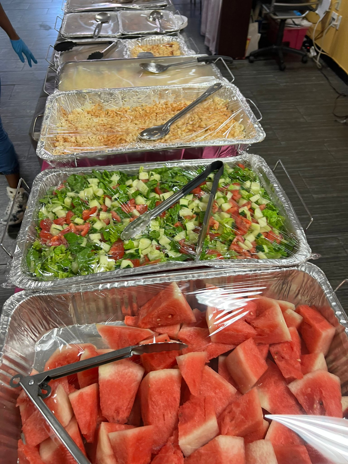 Fresh salads, watermelon and catered dishes for members